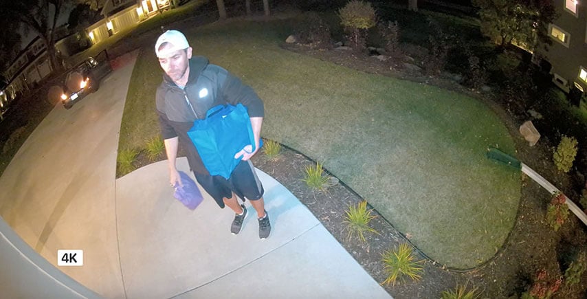 Smart phone displaying 180&deg; viewing angle and HDR video quality, showing someone at door from head to toe